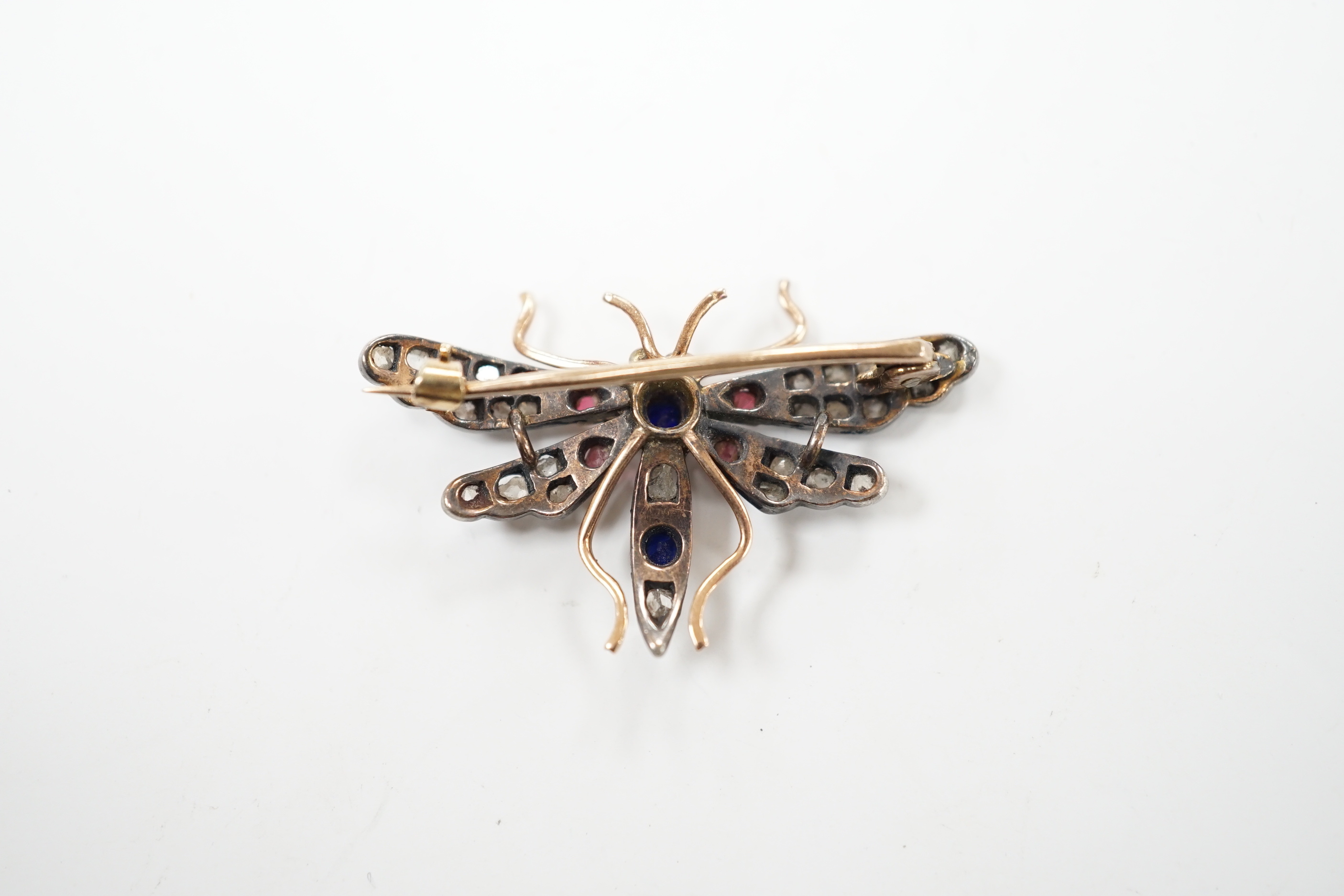 A Victorian yellow and white metal, rose cut diamond and two colour paste? set bug brooch, width 35mm, gross weight 4 grams.